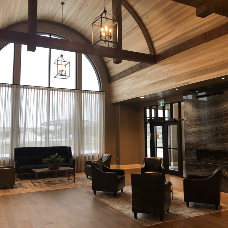 Spacious entrance lobby with chairs and large glass window