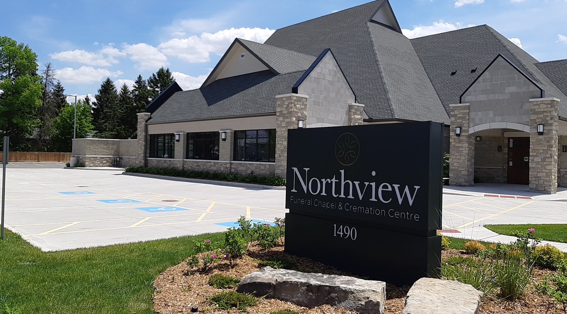 Exterior of a funeral home with bricks walls and the visible Northview sign at the entrance.